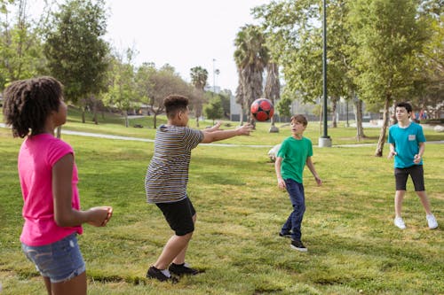 10 Ways to Help Your Homeschooler Find Friends Teenagers Having Fun Playing Soccer Ball on a Park