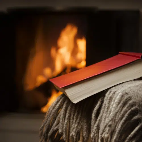 book in front of fireplace - winter homeschooling